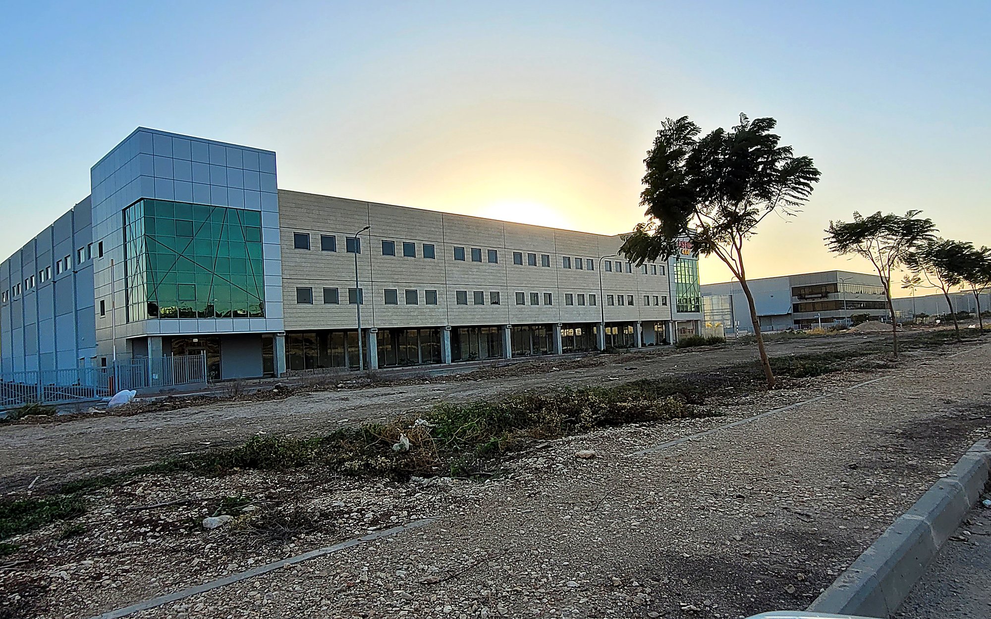 Glass-Entry Industrial Building at dusk
